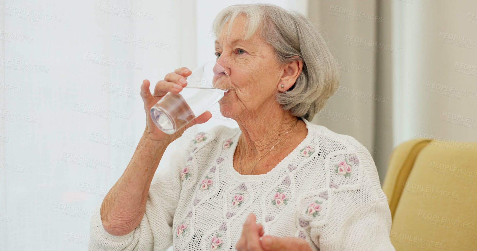 Buy stock photo Water, pills and senior woman on a sofa with medicine for health, balance and aging wellness in her home. Tablet, swallow and elderly lady in living room with vitamin c, collagen or iron and calcium