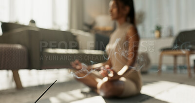 Woman, yoga and incense on floor, lotus or peace for chakra balance, relax or breath in home living room. Girl, meditation or spiritual with zen, smoke or workout for wellness, fitness or mindfulness