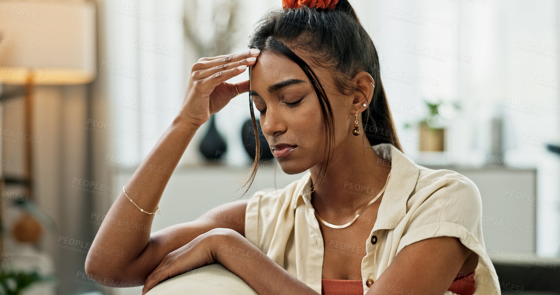 Buy stock photo Woman, depression and headache in living room for anxiety, mental health and stress of fatigue, mistake and debt at home. Pain, sad and frustrated indian person with trauma, broken heart and crisis 