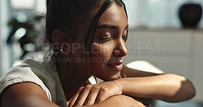 Buy stock photo Thinking, calm and young woman on a sofa relaxing with an idea or memory in living room. Peace, smile and happy Indian female person chilling in the lounge of modern apartment for breathing.