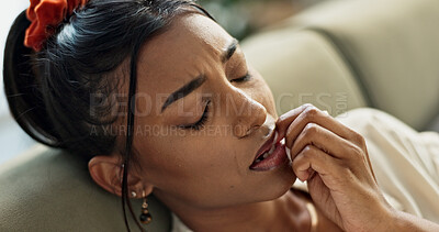 Buy stock photo Stress, anxiety and woman biting nails on sofa with fear, worry or mental health crisis at home. Face, frustrated and female person in living room with trauma, nervous or overthinking mistake