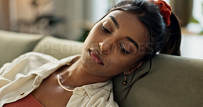 Buy stock photo Depression, anxiety and young woman on a sofa relaxing with an idea or memory in living room. Anxious, mental health and nervous Indian female person with reflection in the lounge of modern apartment