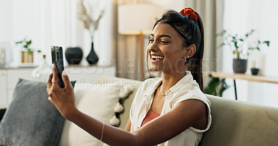 Buy stock photo Woman, selfie and smile on sofa in home living room with web blog, post or update on mobile app. Influencer girl, live streaming or video call with memory, profile picture and social media in house