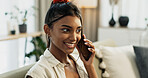 Phone call, smile and young woman on a sofa for relaxing in the living room of apartment. Happy, communication and Indian female person on mobile conversation with cellphone in lounge of modern home.