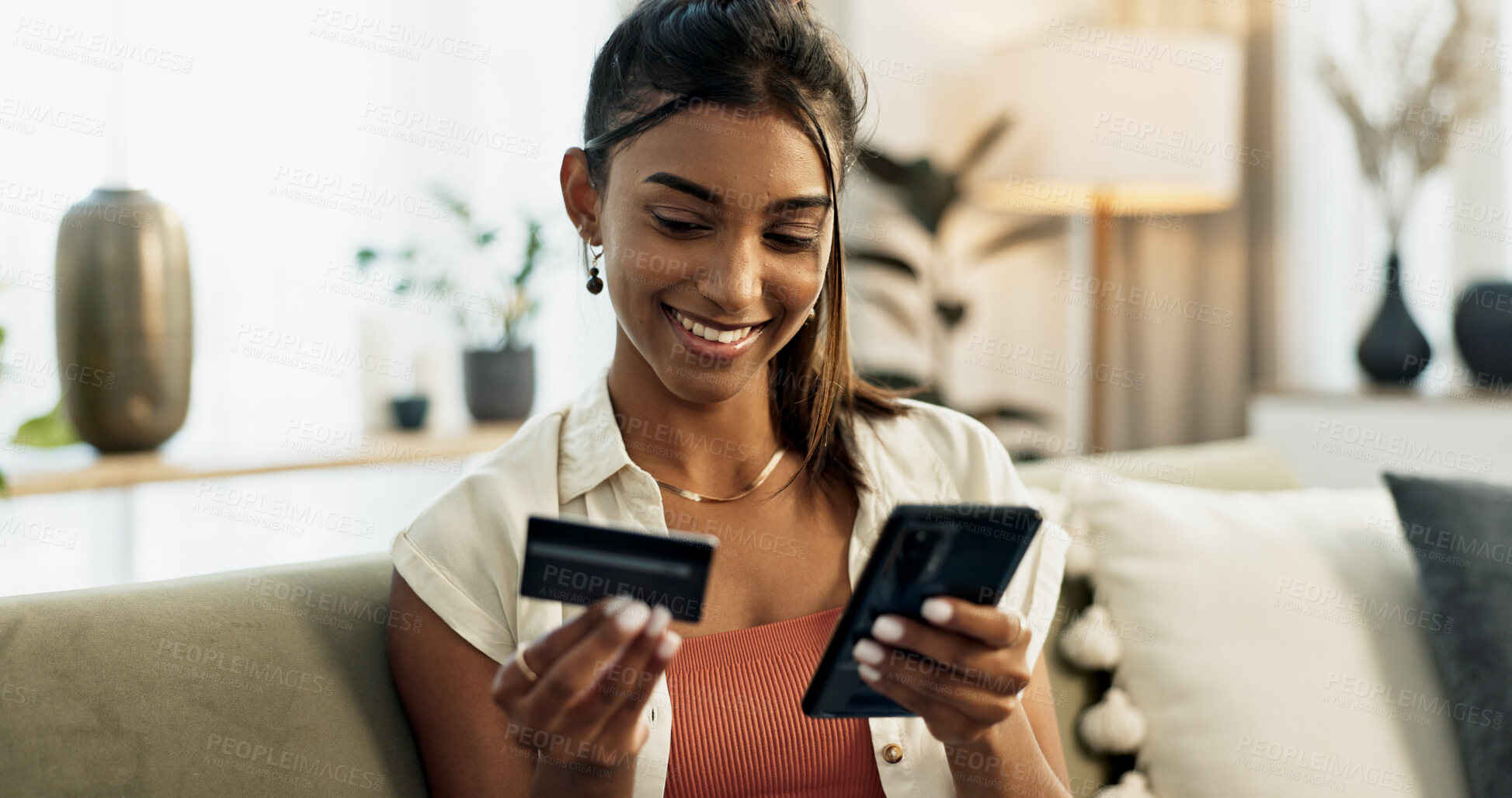 Buy stock photo Woman, credit card and phone on sofa, smile or reading with cybersecurity, fintech app or bank info in home. Girl, smartphone and payment for password, budget or online shopping on e commerce website