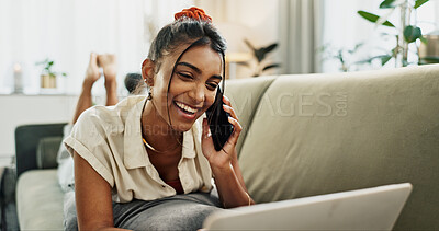 Buy stock photo Phone call, happy and woman with a laptop on a sofa for relaxing in the living room of apartment. Smile, communication and Indian person on mobile conversation with cellphone in lounge of modern home