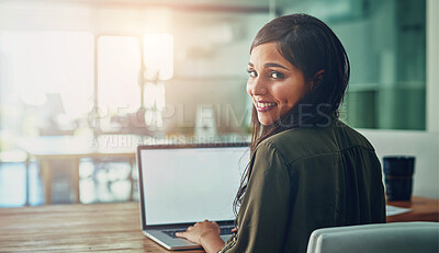 Buy stock photo Portrait of a young designer working on a laptop in an office