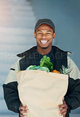 Buy stock photo Portrait of a courier making a grocery delivery