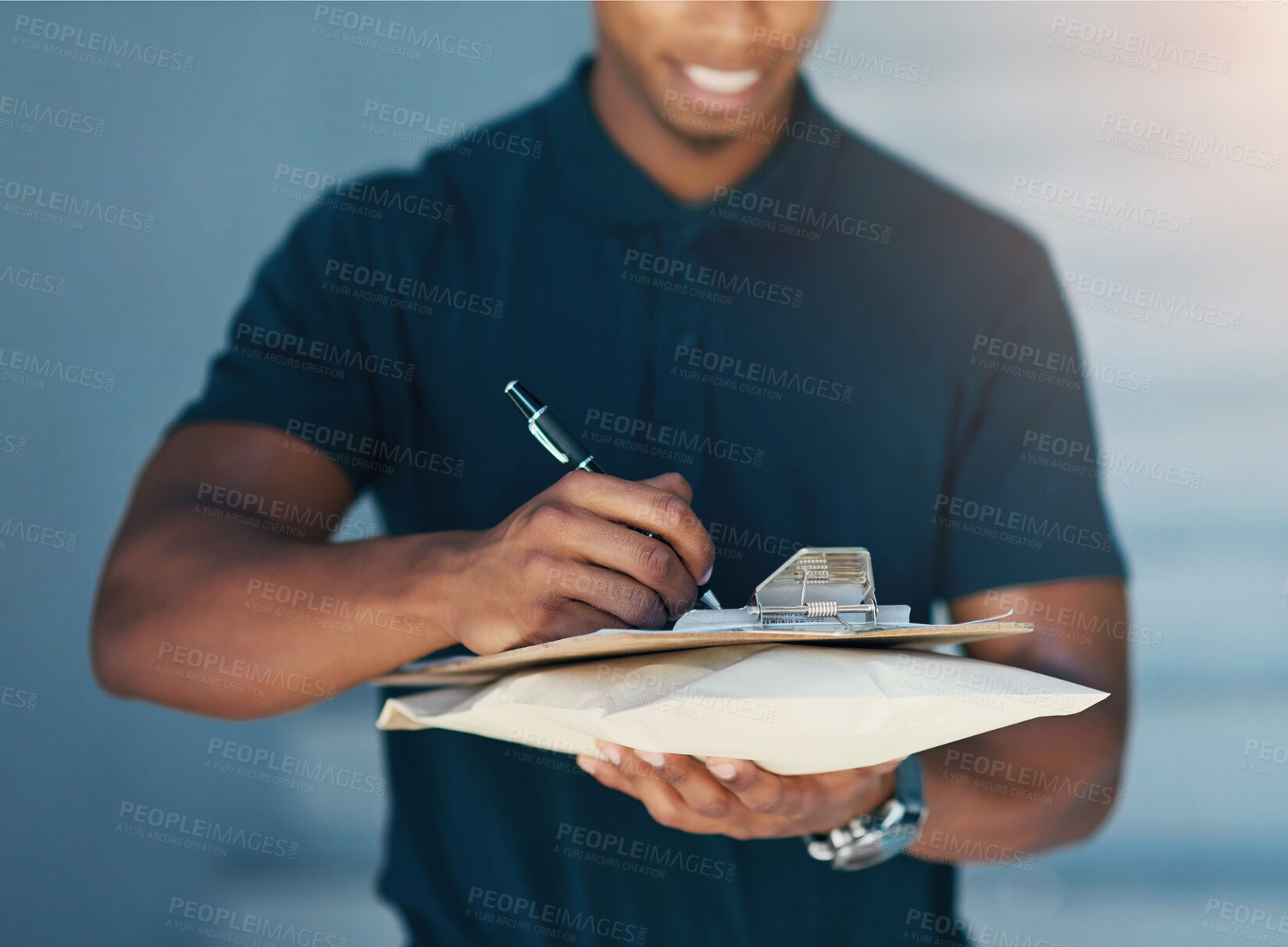 Buy stock photo Cropped shot of an unidentifiable courier filling in paperwork while out on a delivery