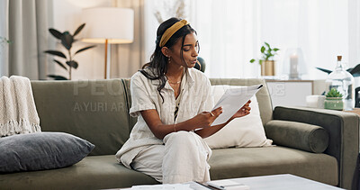 Buy stock photo Woman reading documents in home for budget, planning finance and student loan information. Indian girl check banking report, paperwork and bills for investment, taxes and savings for insurance policy