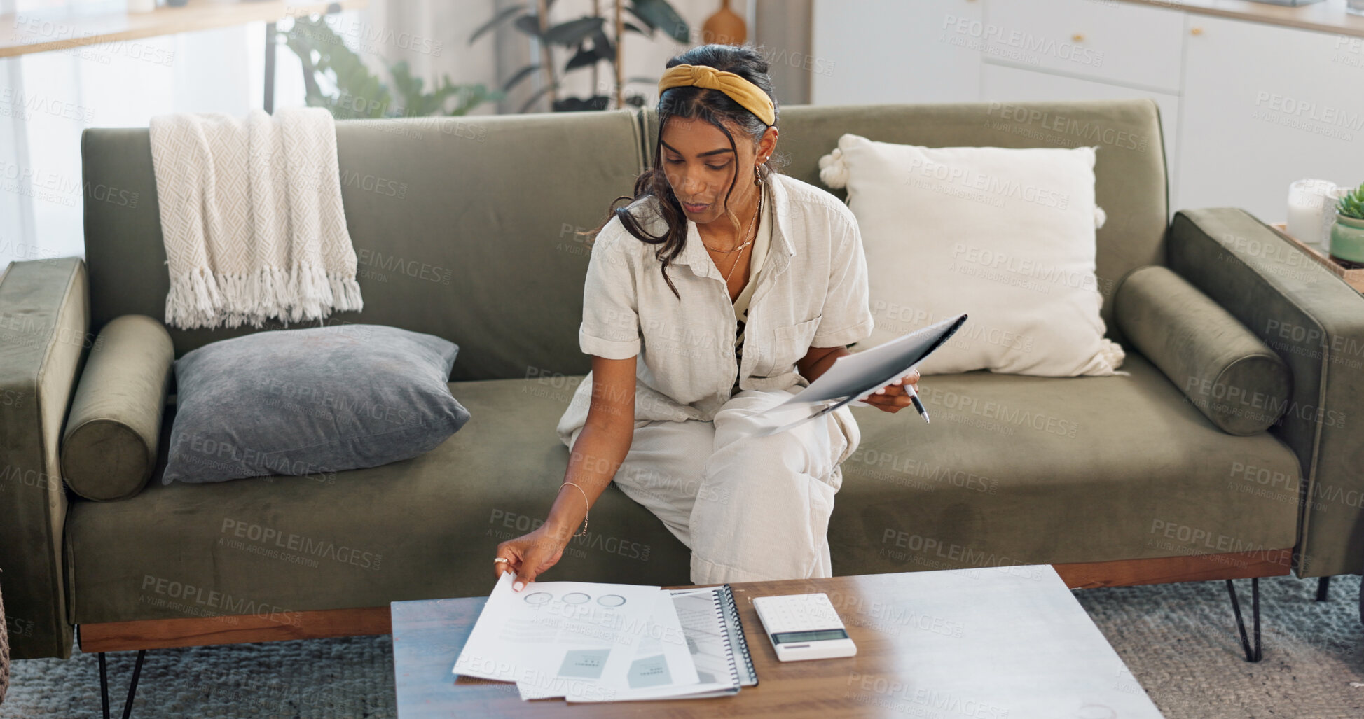 Buy stock photo Woman, documents and budget on sofa for home planning, financial report and asset management or insurance. Young freelancer reading paperwork, information and data analytics or statistics in lounge