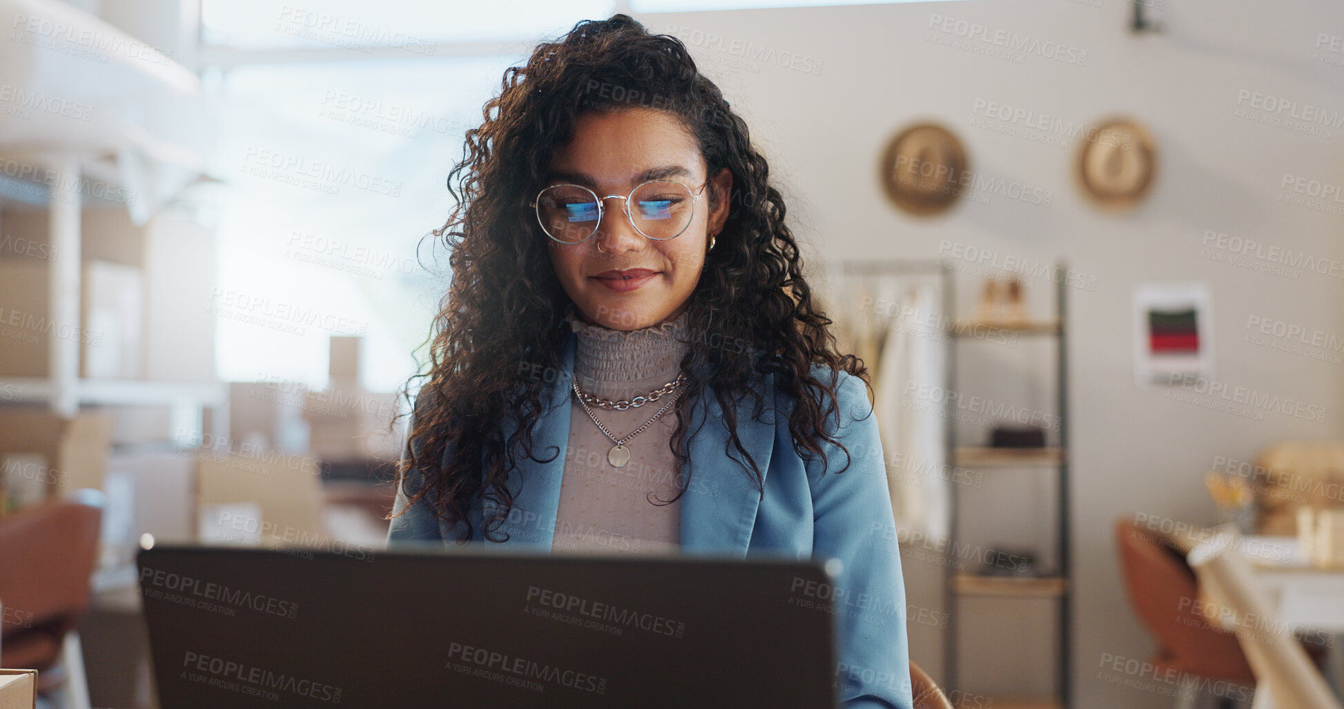 Buy stock photo Woman, fashion designer and laptop in small business management, logistics or research at boutique. Female person or entrepreneur working on computer for inventory or storage check at retail store