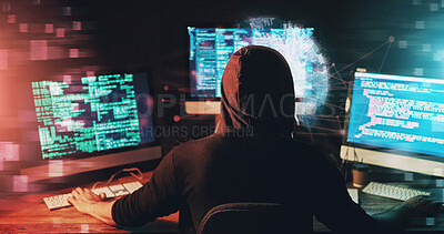 Buy stock photo Rearview shot of a young hacker cracking a computer code in the dark