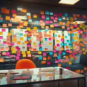 Bright and colorful post-its or sticky notes on a glass wall. For ...