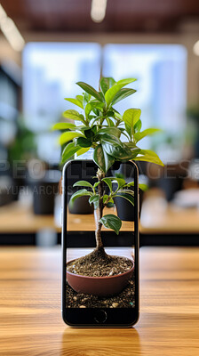 Picture of plant growing out of smartphone. Ecology Concept.