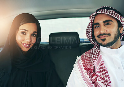 Buy stock photo Portrait of a young arabic couple traveling in a luxury car