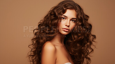 Portrait of young brunette woman with long wavy hair. Hair care, make-up and hair health