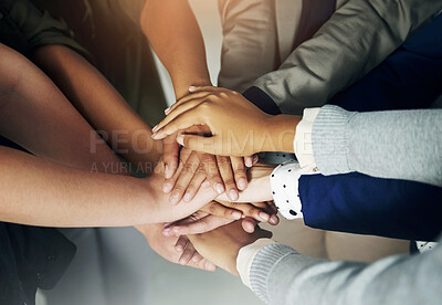 Buy stock photo Closeup shot of a group of unrecognisable businesspeople joining their hands together in unity