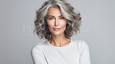 Portrait of mature woman with curly wavy grey hair. Hair care, make-up and hair health