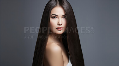 Portrait of young woman with long straight black hair. Hair care, make-up and hair health
