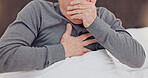 Sick, cough and closeup of senior man in bed with allergies, flu or cold on weekend morning at home. Illness, chest pain and zoom of elderly male person in retirement with asthma in bedroom at house.