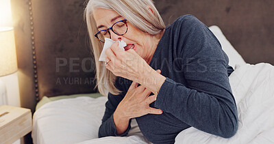 Buy stock photo Sick, blowing nose and senior woman in bed with allergies, flu or cold on weekend morning at home. Illness, sneezing and elderly female person in retirement with tissue for sinus in bedroom at house.