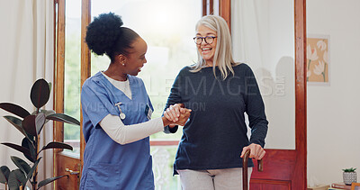 Senior woman, nurse and help with walking stick for rehabilitation, wellness and talk with smile. African caregiver, happy patient and elderly person with disability, cane and support for recovery