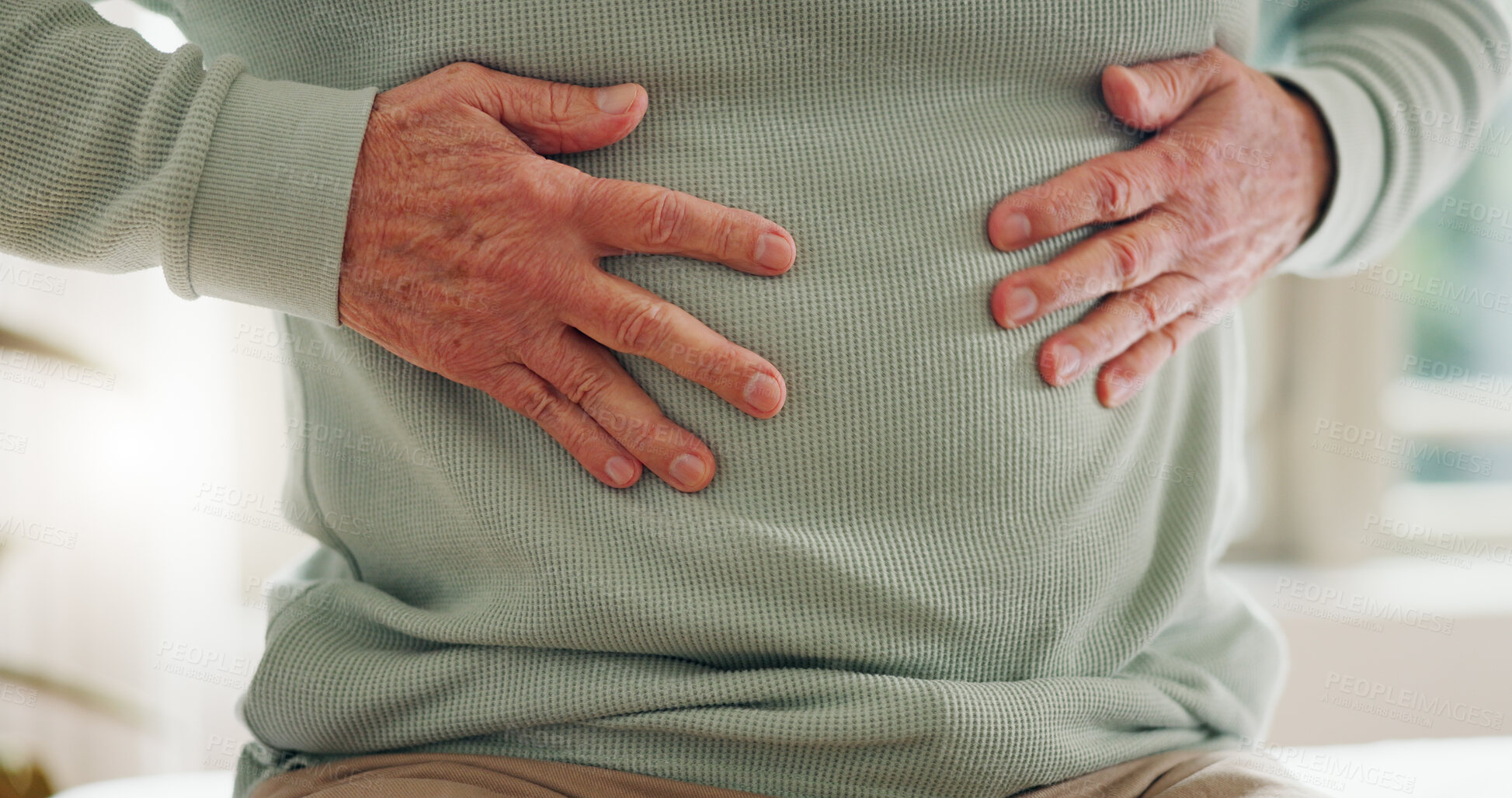 Buy stock photo Hands on stomach, closeup and gut health, digestion and nutrition with elderly care and person has pain. Sick, colon and gas with healthcare and wellness, help and support for stress and illness