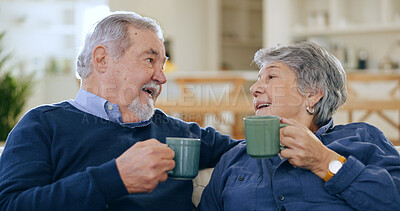 Buy stock photo Coffee, love and a senior couple in their home to relax together during retirement for happy bonding. Smile, romance or conversation with an elderly man and woman drinking tea in their living room