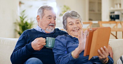 Buy stock photo Tablet, coffee and a senior couple in their home to relax together during retirement for happy bonding. Technology, smile or love with an elderly man and woman drinking tea in their living room