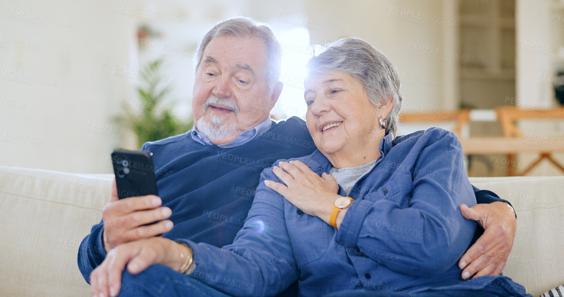 Buy stock photo Home, typing and old couple with cellphone, love and connection with social media, speaking and digital app. People, mature man or senior woman with smartphone, online reading and website information