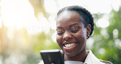 Black woman, typing and phone outdoor in park, nature or garden with communication on social media. Online, happiness and person reading a funny meme, post or joke or chat on internet with cellphone