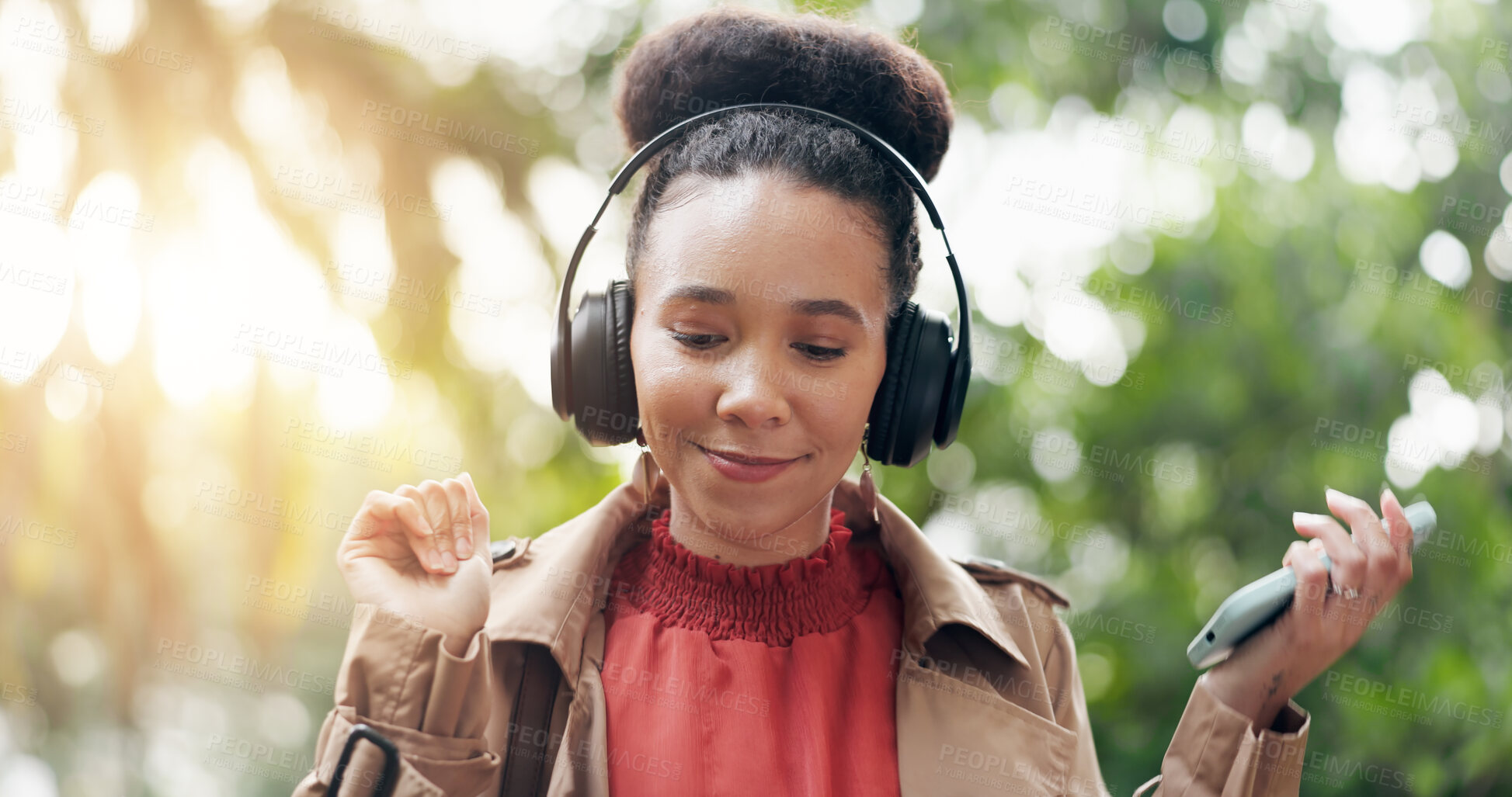 Buy stock photo Happy woman, phone and headphones in nature for music, audio streaming or outdoor sound track. Female person smile with technology on smartphone listening to podcast, playlist or songs at park