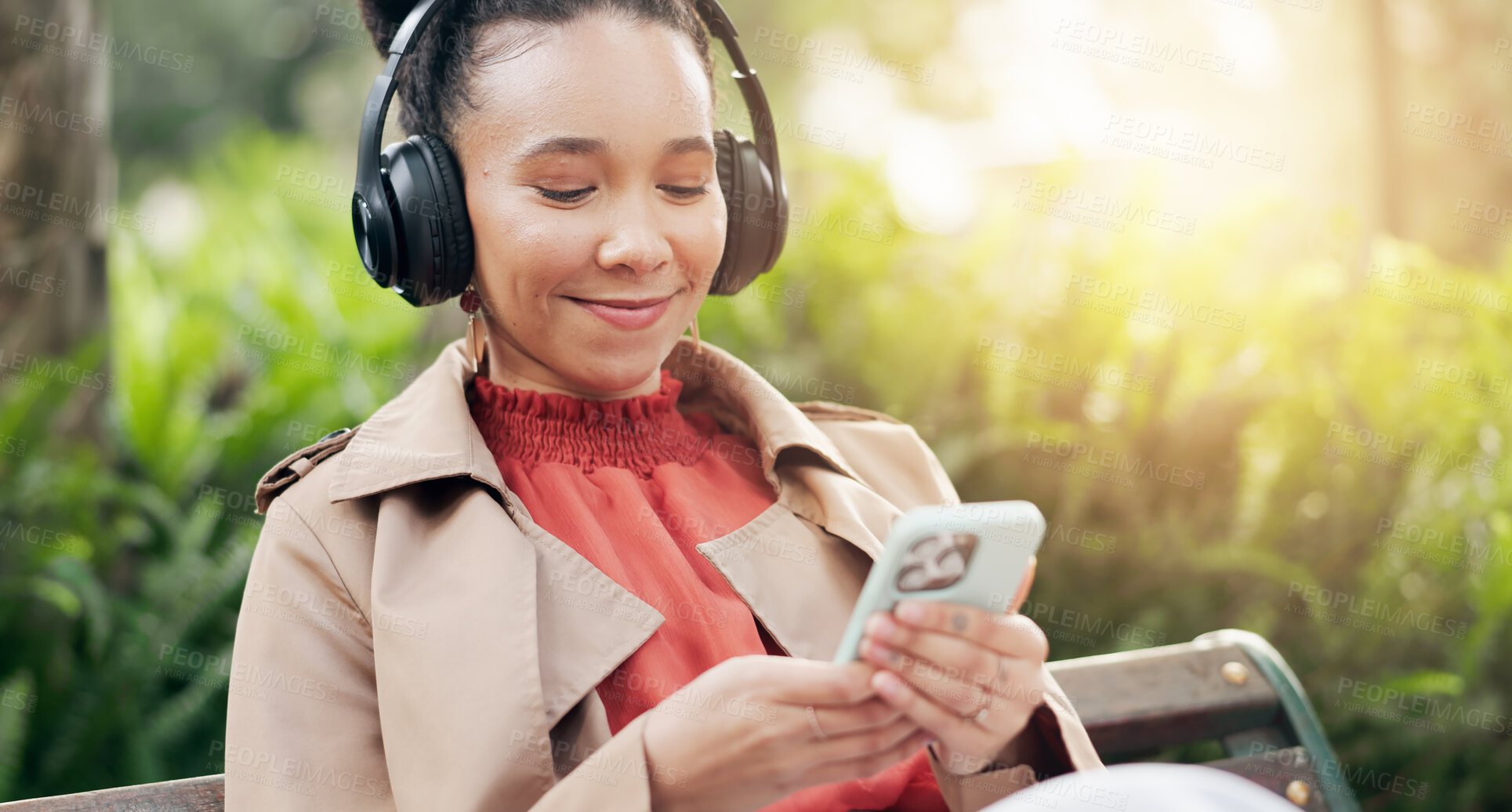 Buy stock photo Smile, phone and woman with headphones for streaming radio, playlist and podcast or relax in outdoors. Happy female person, listening to song, sound and music or audio, nature and internet on mobile