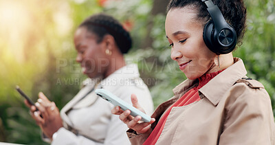 Happy, phone and woman with headphones for fun, funny and podcast or song, energy and relax in outdoors. People, streaming radio and music or audio, nature and internet on smartphone for playlist