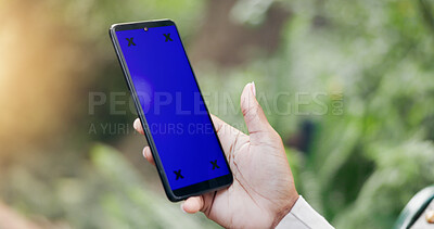 Woman, phone and hands with blue screen for marketing, advertising or app in outdoor nature. Closeup of female person with mobile smartphone display with chromakey or tracking markers on mockup space