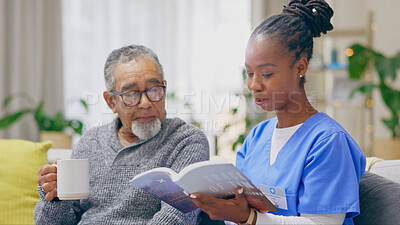 Coffee, reading book or senior man with nurse on sofa for nursing home, retirement or house. Healthcare, help or elderly patient with caregiver, black woman or volunteer in hospice for rehabilitation