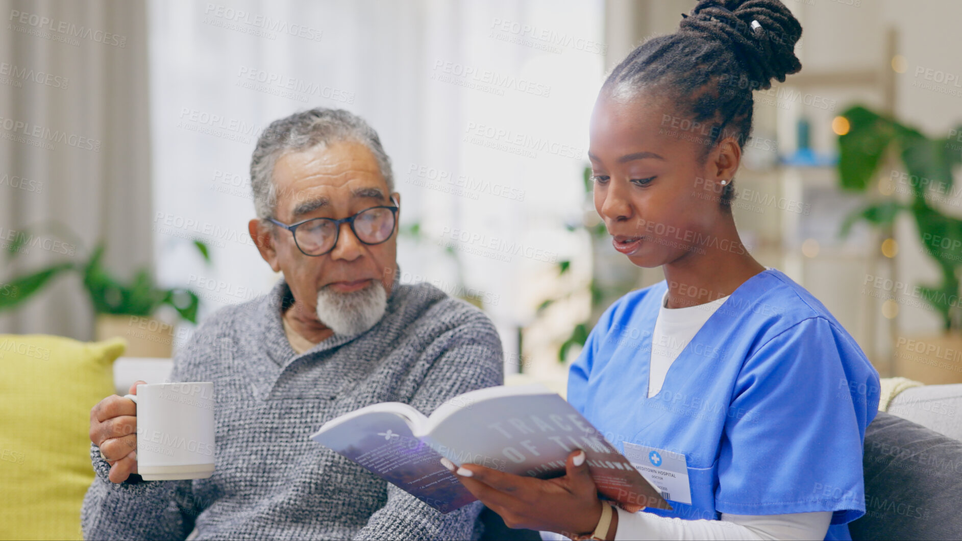 Buy stock photo Coffee, reading book or senior man with nurse on sofa for nursing home, retirement or house. Healthcare, help or elderly patient with caregiver, black woman or volunteer in hospice for rehabilitation