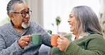 Senior couple, conversation and happy for coffee, home and retired for love, relax and enjoy. Retirement, old age and elderly in house, bonding together and quality time for discussion, man and woman