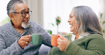 Senior couple, conversation and happy for coffee, home and retired for love, relax and enjoy. Retirement, old age and elderly in house, bonding together and quality time for discussion, man and woman