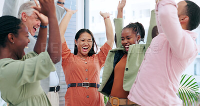 Happy creative people, meeting and celebration for teamwork, business or success together at office. Group of employees smile with hands in air for team achievement, promotion or startup at workplace