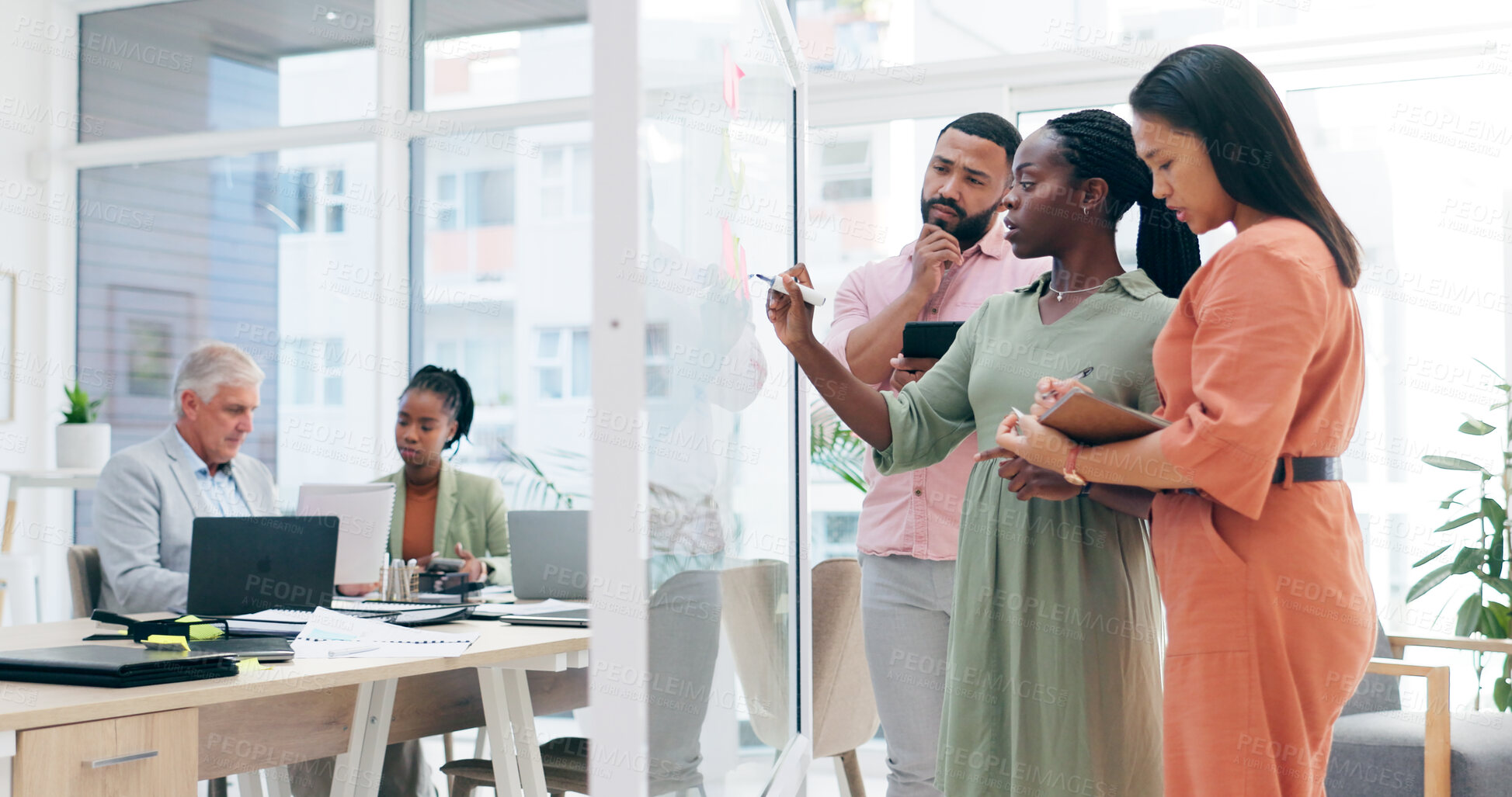 Buy stock photo Business people, teamwork and writing schedule in meeting, planning or notes for strategy on glass board at office. Group of employees in team brainstorming, ideas or reminder for agenda at workplace