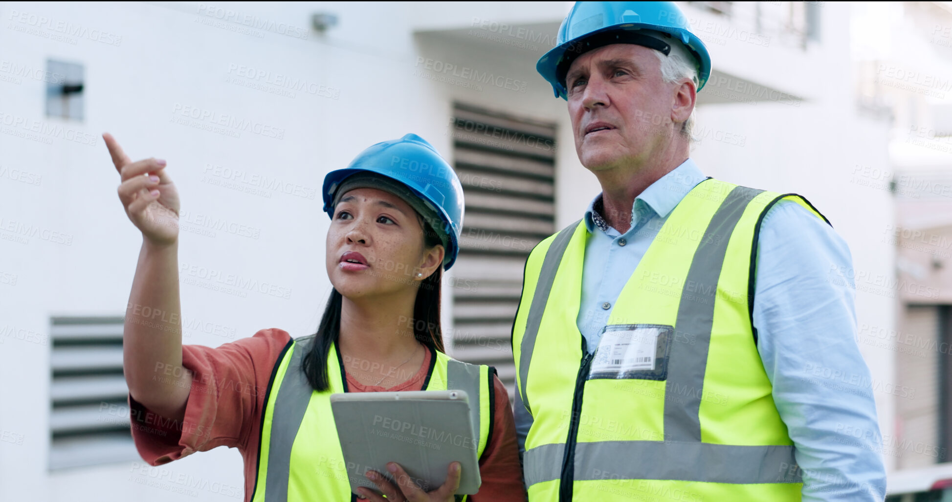 Buy stock photo Construction, team and tablet for inspection with people at job site, mentor and apprentice with communication. Architecture, engineering and digital floor plan, old man and woman outdoor in meeting