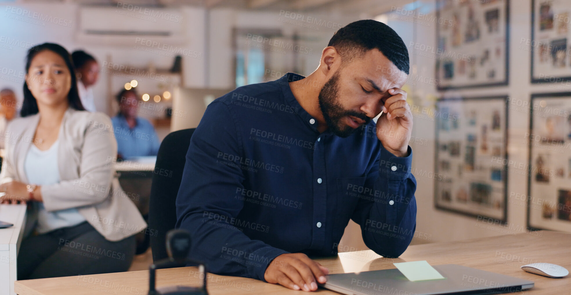 Buy stock photo Black man, headache and stress in office, deadline and laptop for work, mental health and upset. Employee, overworked and exhausted for business, career and upset for mistake, burnout and migraine