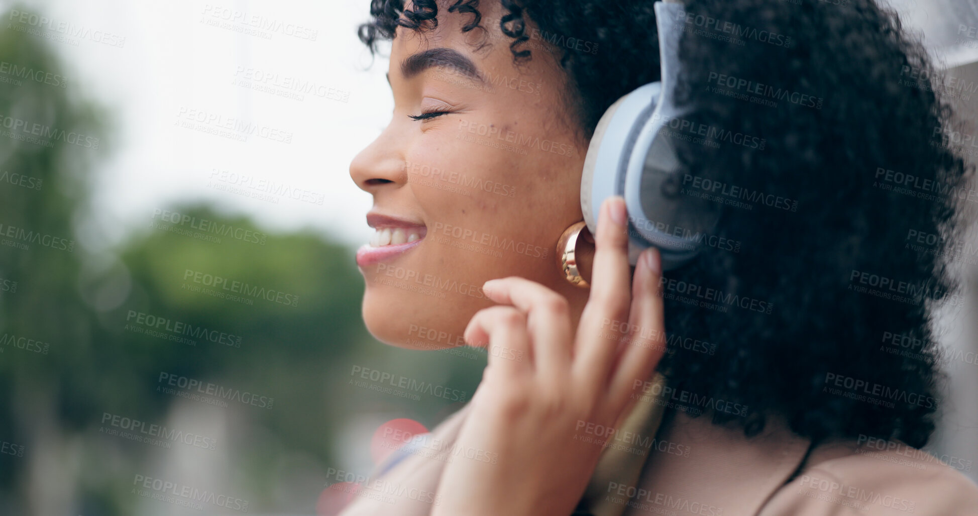 Buy stock photo Businesswoman, headphones and listening to music with eyes closed on street, city or outside by commute. African person, curly hair and smile for podcast, streaming or radio with internet, web or app