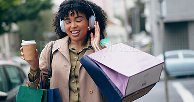Headphones, shopping bag or happy woman in city for boutique retail sale, or clothes discount deal. Coffee, financial freedom or rich customer walking on street streaming radio music with fashion