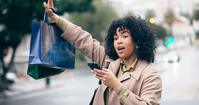 Woman, call or wave with hand for taxi by holding phone with shopping bag on street for travel. African person, manager and late for meeting, appointment or work in city with transportation commute