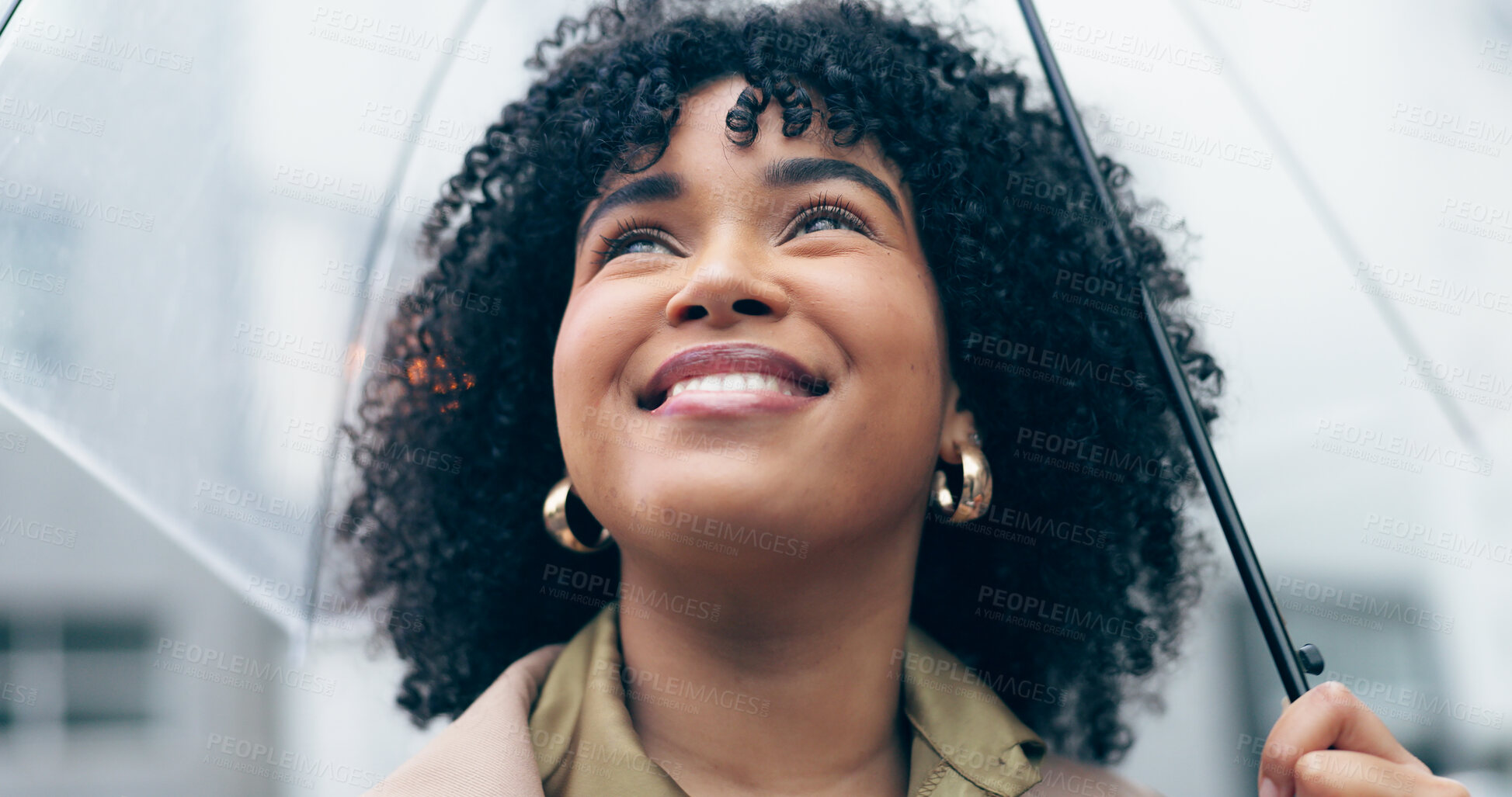 Buy stock photo Woman, face and happy outdoor with umbrella for rain, weather and safety with travel in urban city. Person, journey or commute to work with security, water drops or storm town or street in winter