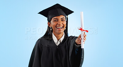 Graduation, certificate and girl in studio portrait for pride, success or achievement by blue background. Graduate woman, diploma or excited for award, celebration or paperwork for future at college