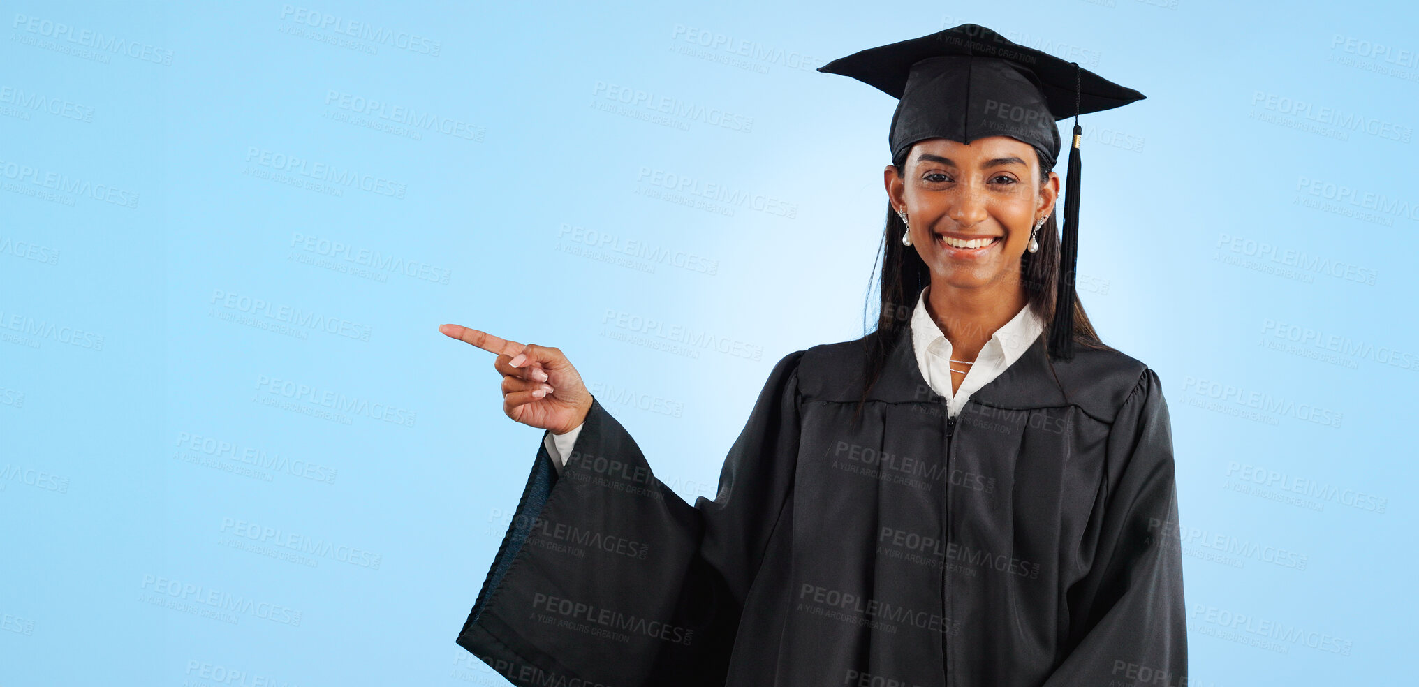 Buy stock photo Graduate, studio portrait or happy woman point at school registration, university ads or college information, choice or academy. Mockup space, education and graduation notification on blue background